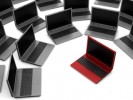 red laptop among gray similar isolated on white background red laptop among gray similar isolated on white background