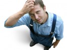 young worker in working clothes, wondering young worker in working clothes, wondering